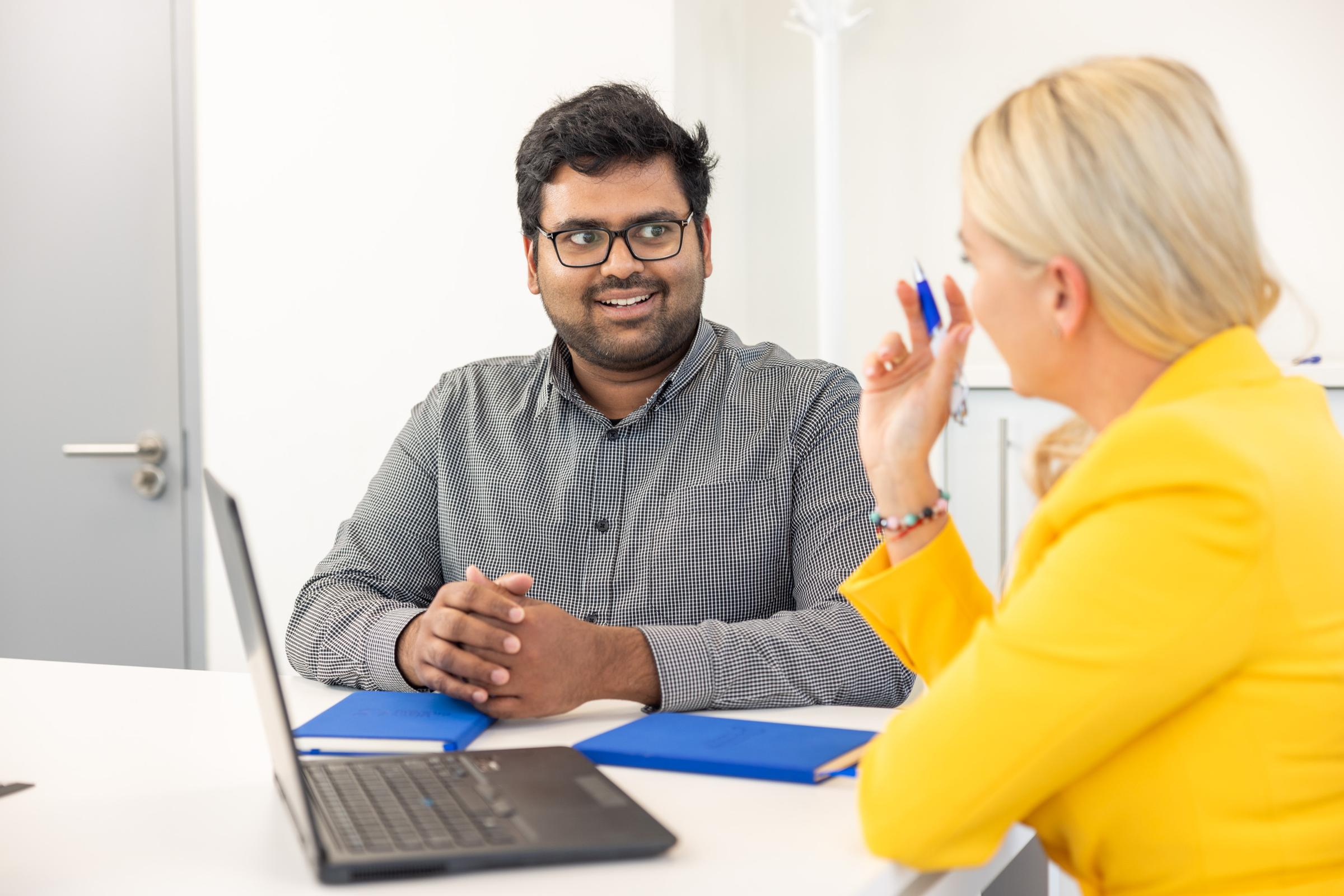 Two office workers in a meeting