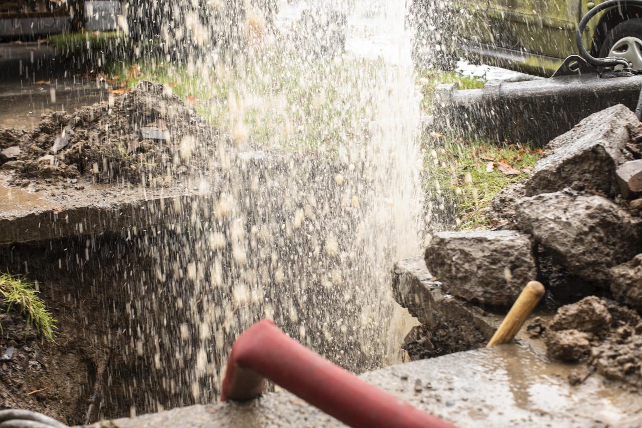 A leak from a pipe in the ground