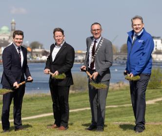 A group of men in suits with shovels on a site in Athlone