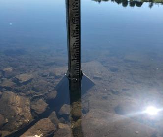 A measuring stick in a water reservoir